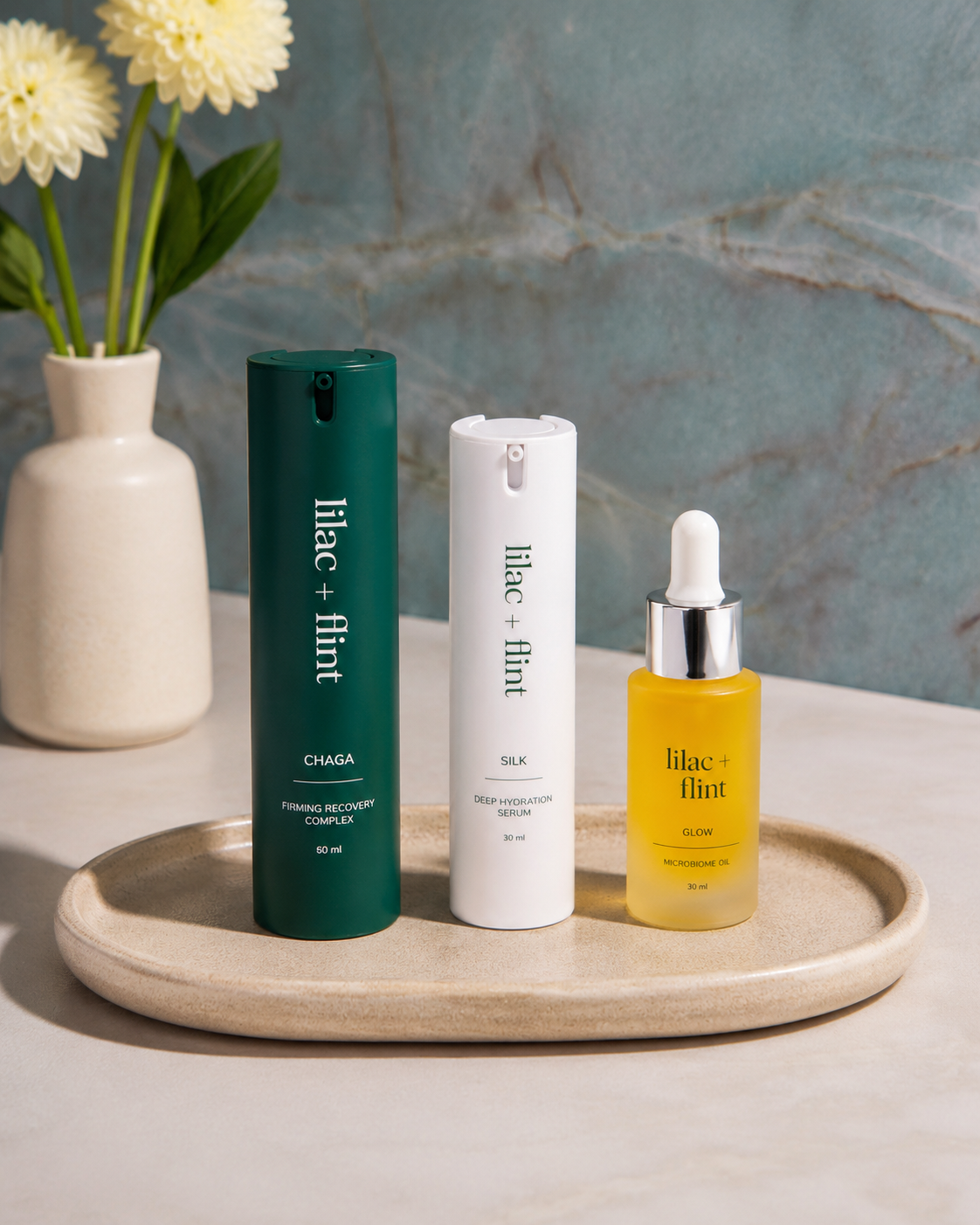 The lilac + flint Glow Trio Barrier Rescue featuring Silk Serum, Chaga Moisturizer and Glow Oil for dry, sensitive skin and barrier support.